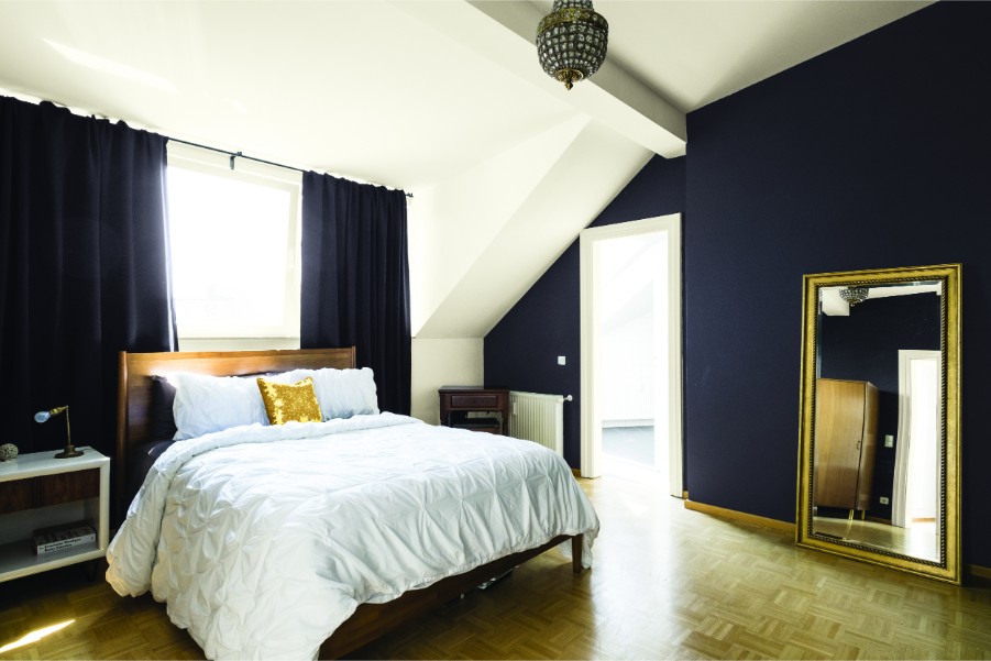 bedroom dark accent wall vaulted ceilings