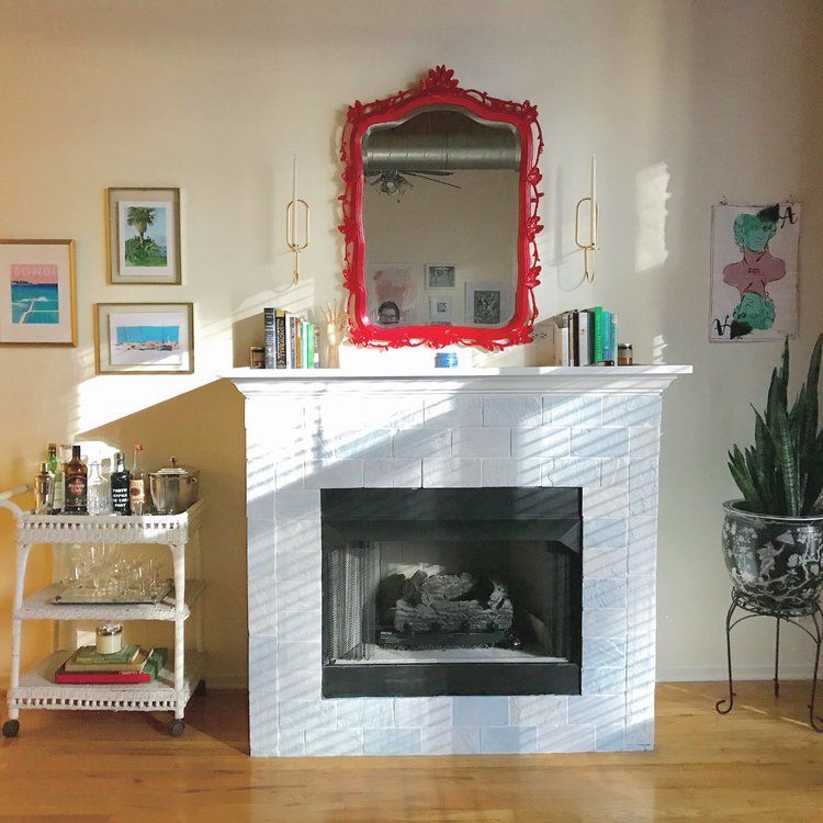 white brick fireplace yellow walls