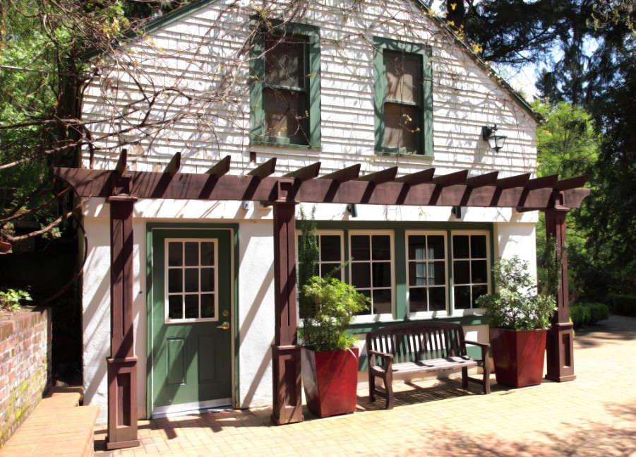 cute cottage with green door and trim