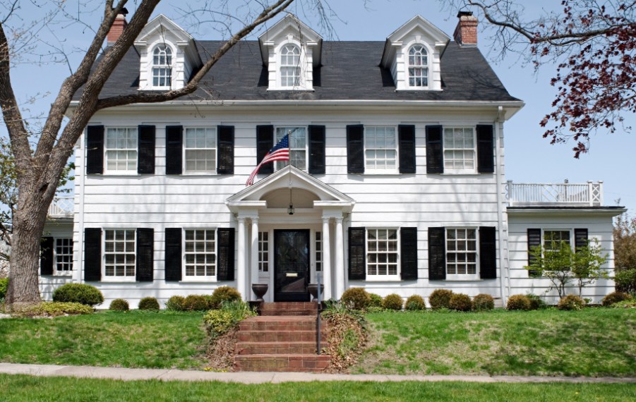 white colonial house white black shutters