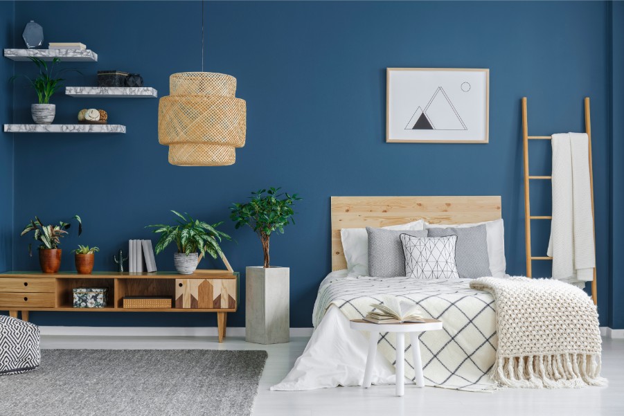 blue bedroom with floating shelves