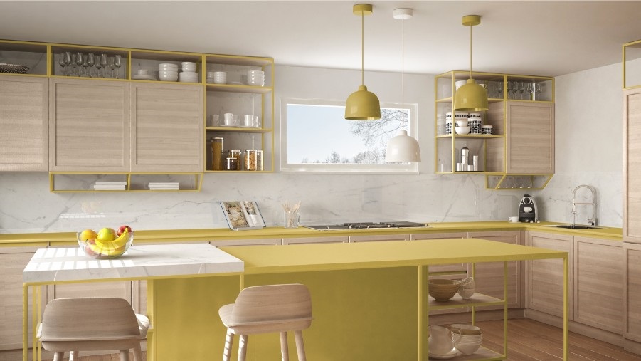 yellow kitchen island with soft wood cabinets