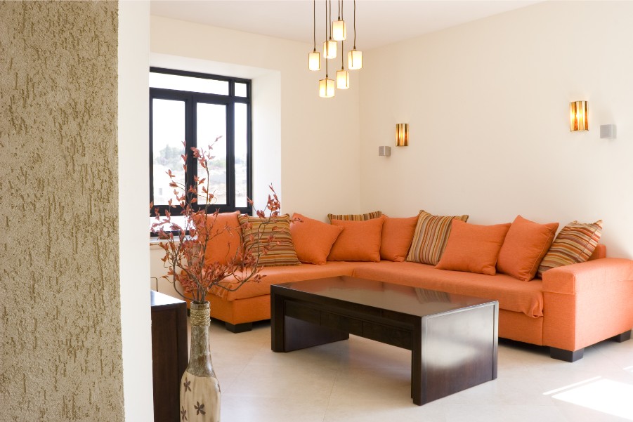 orange couch beige walls
