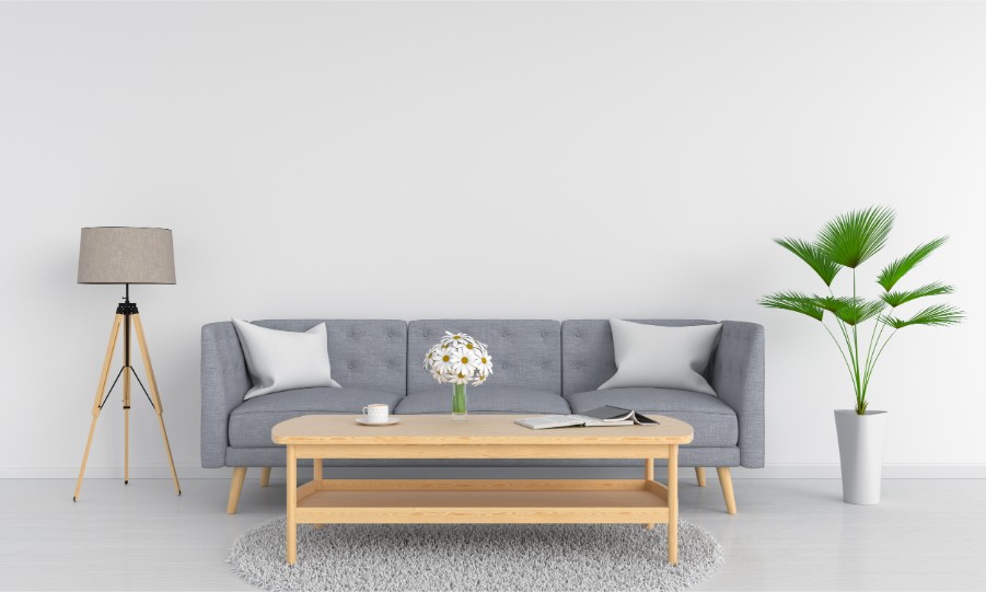 white wall stock photo gray couch