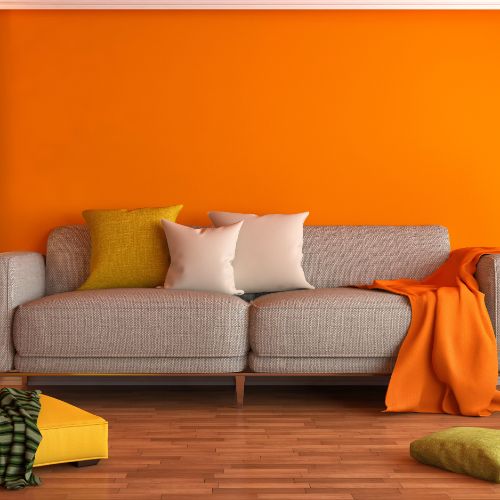 bright orange living room painted for energy