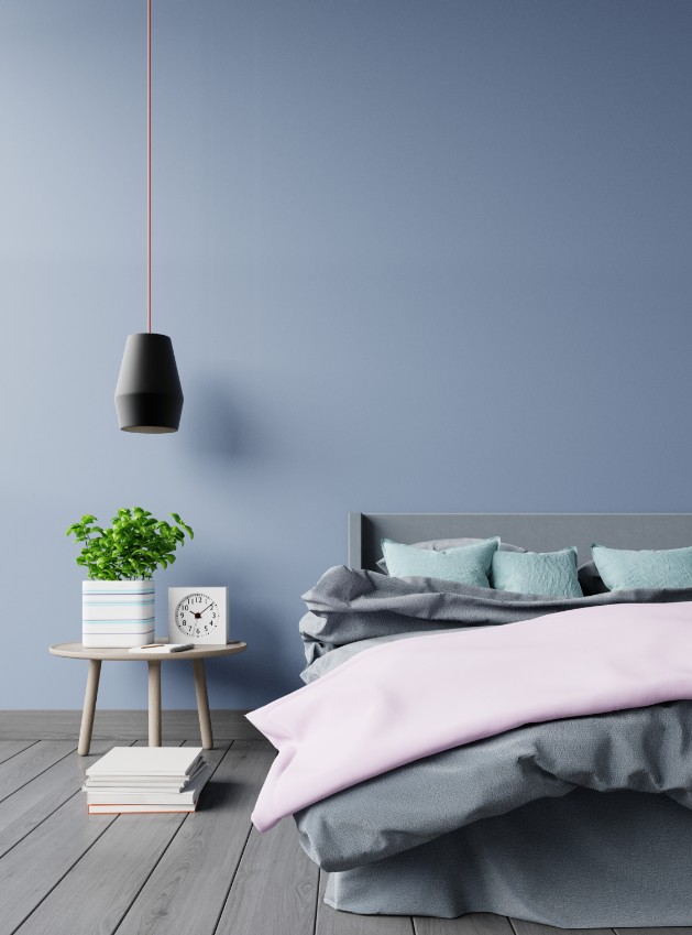 light gray blue painted wall gray bed