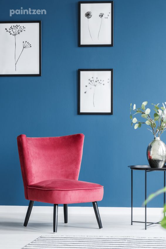 blue accent wall red chair