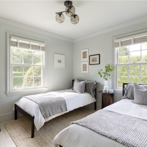 white guest bedroom with twin beds