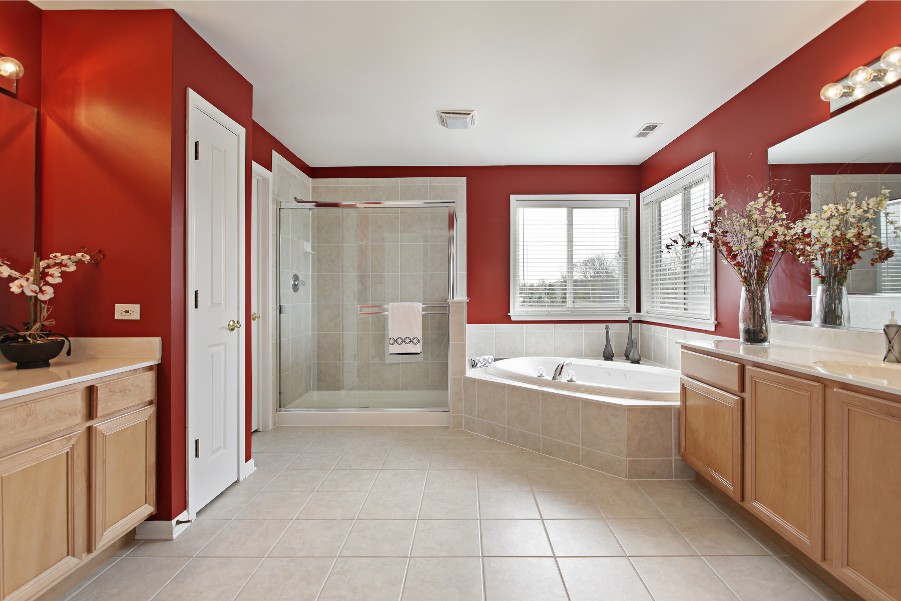 red master bathroom wood cabinets