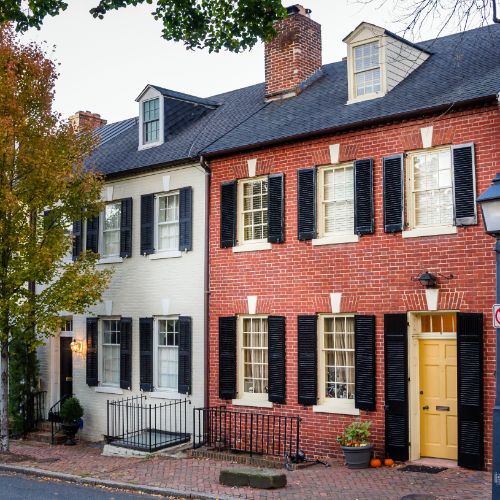 black shutters yellow door