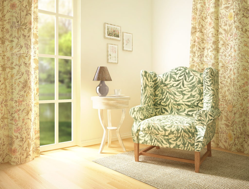 floral green chair in soft yellow room